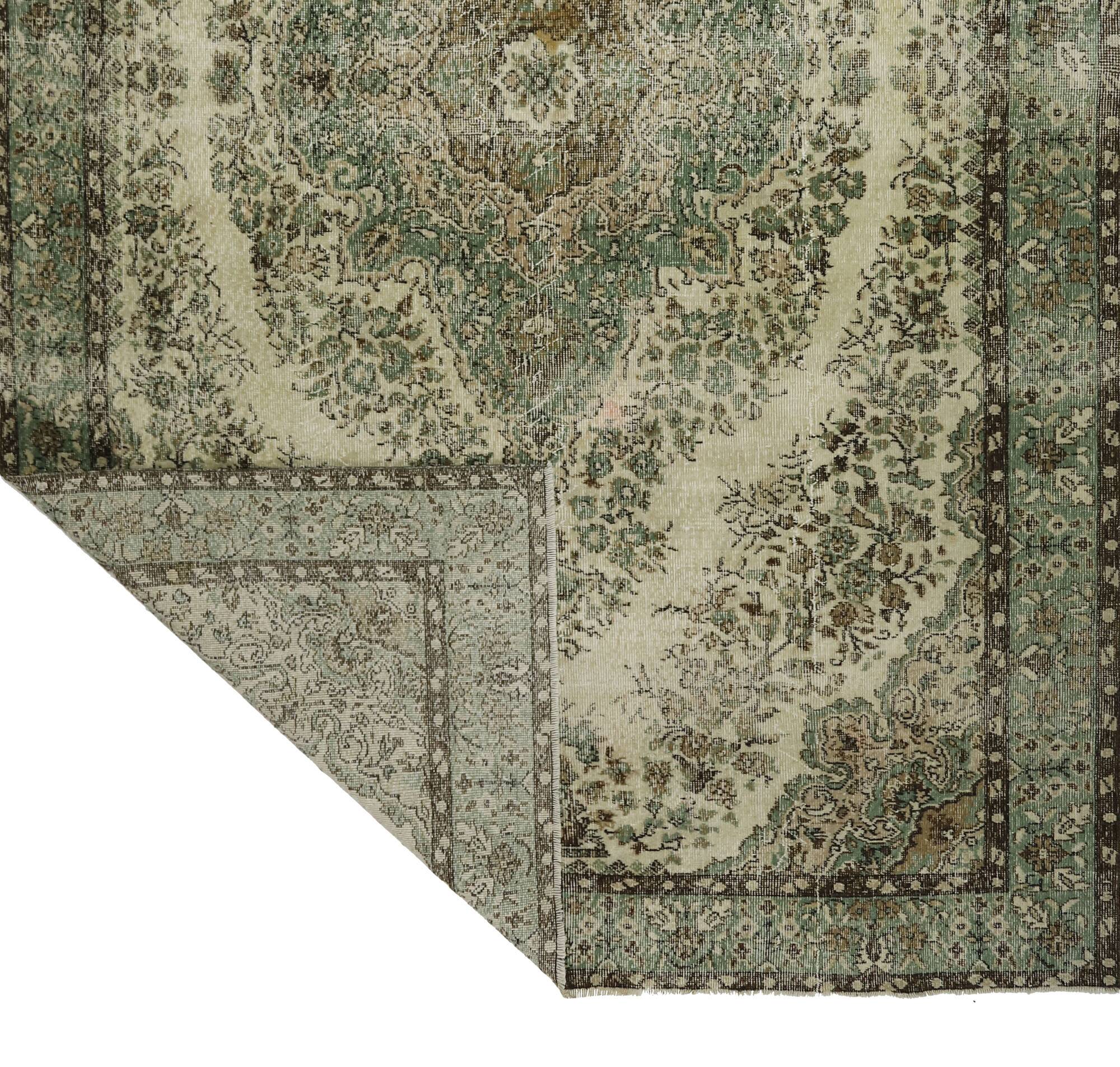 Vintage Oushak rug with green and beige medallion, 345 x 205 cm.