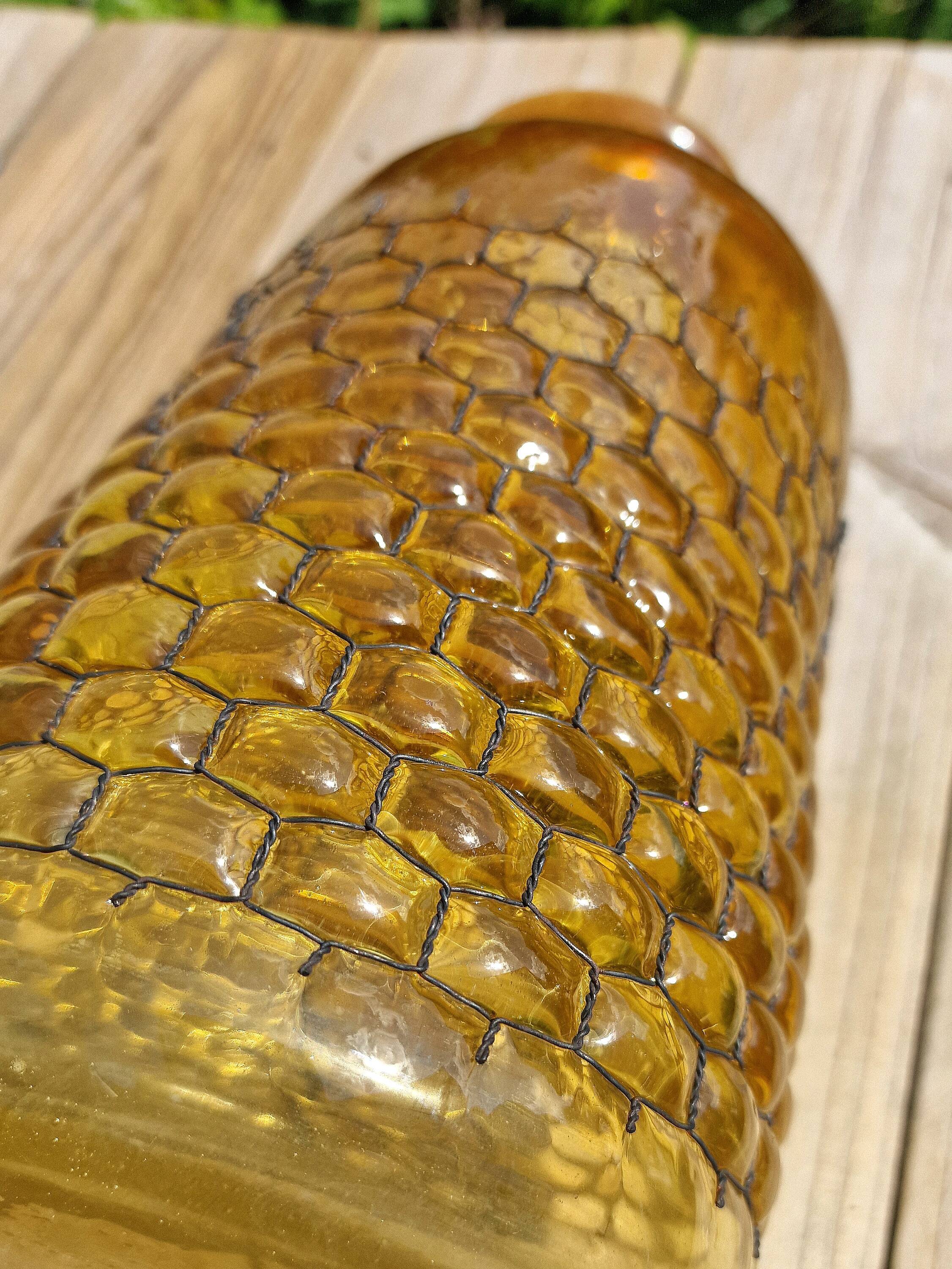 Artisanal blown amber glass vase with integrated honeycomb structure.