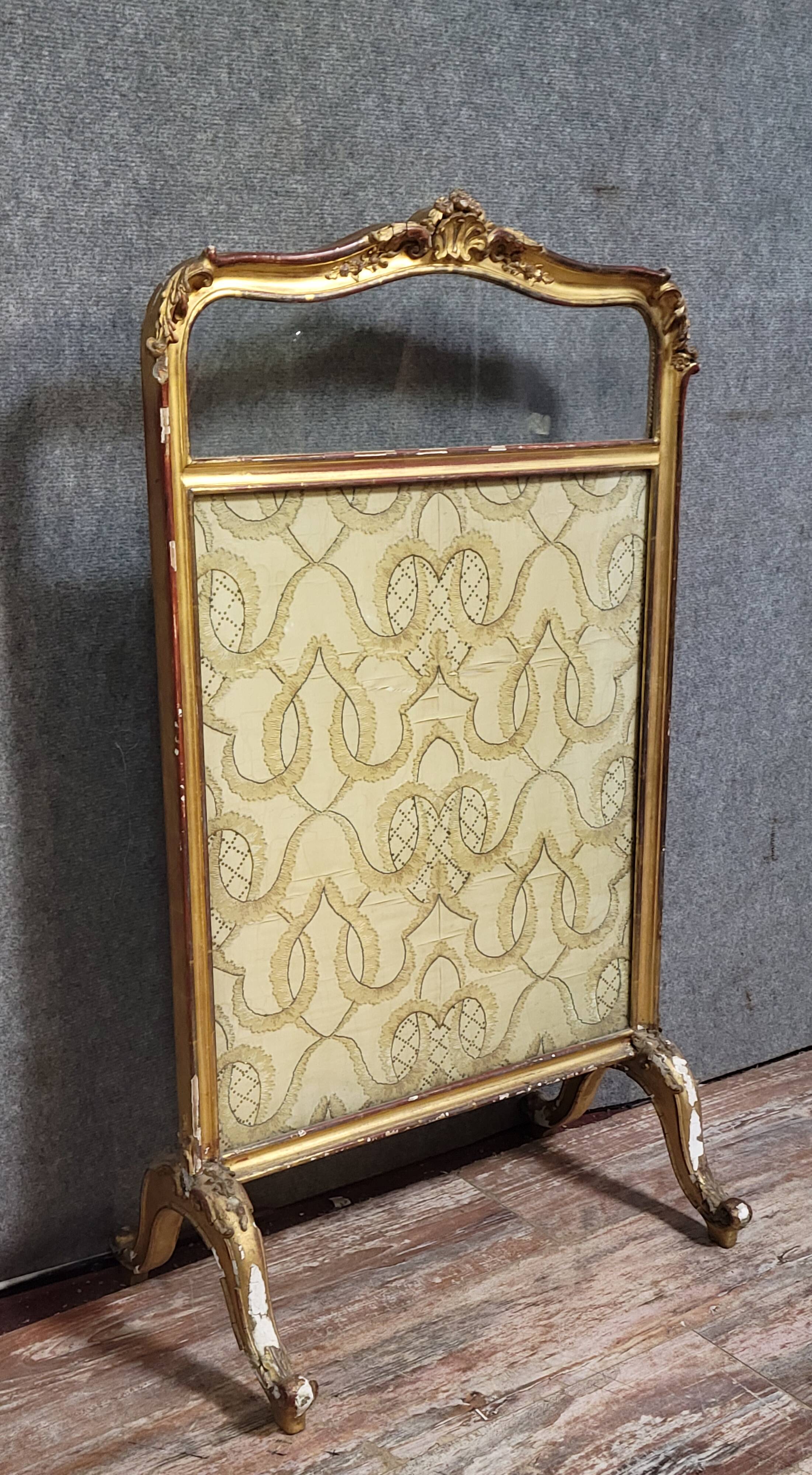Antique Louis XV style fire screen, in carved and gilded wood, in need of restoration
