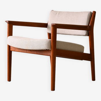 Upholstered armchair with teak frame