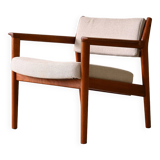 Upholstered armchair with teak frame