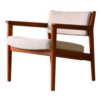 Upholstered armchair with teak frame