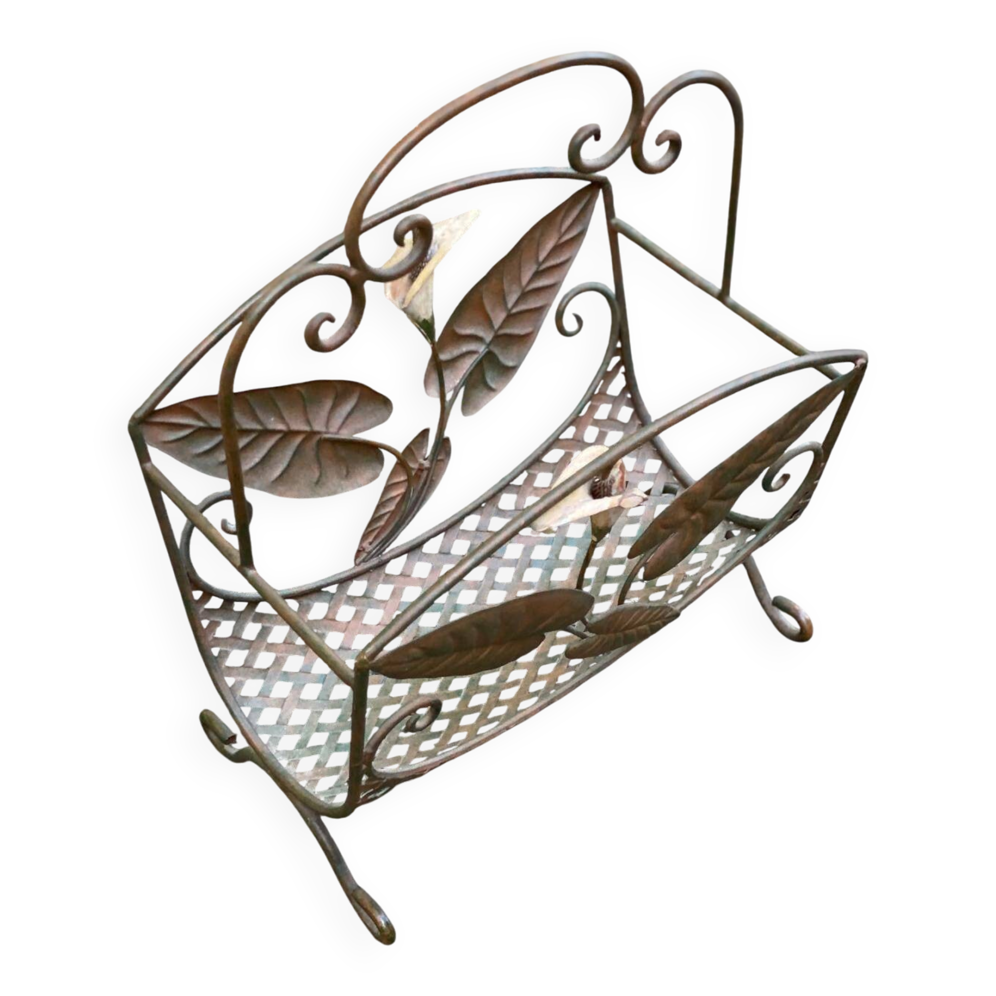 Vintage wrought iron magazine rack with flower pattern.