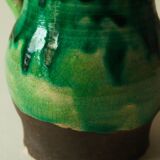 Glazed ceramic pitcher in green and brown by the potter Pierre Roulot.