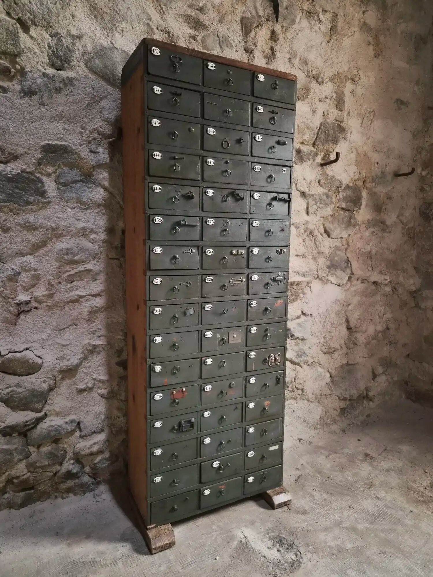 Antique hardware cabinet with 48 drawers, circa 1900.