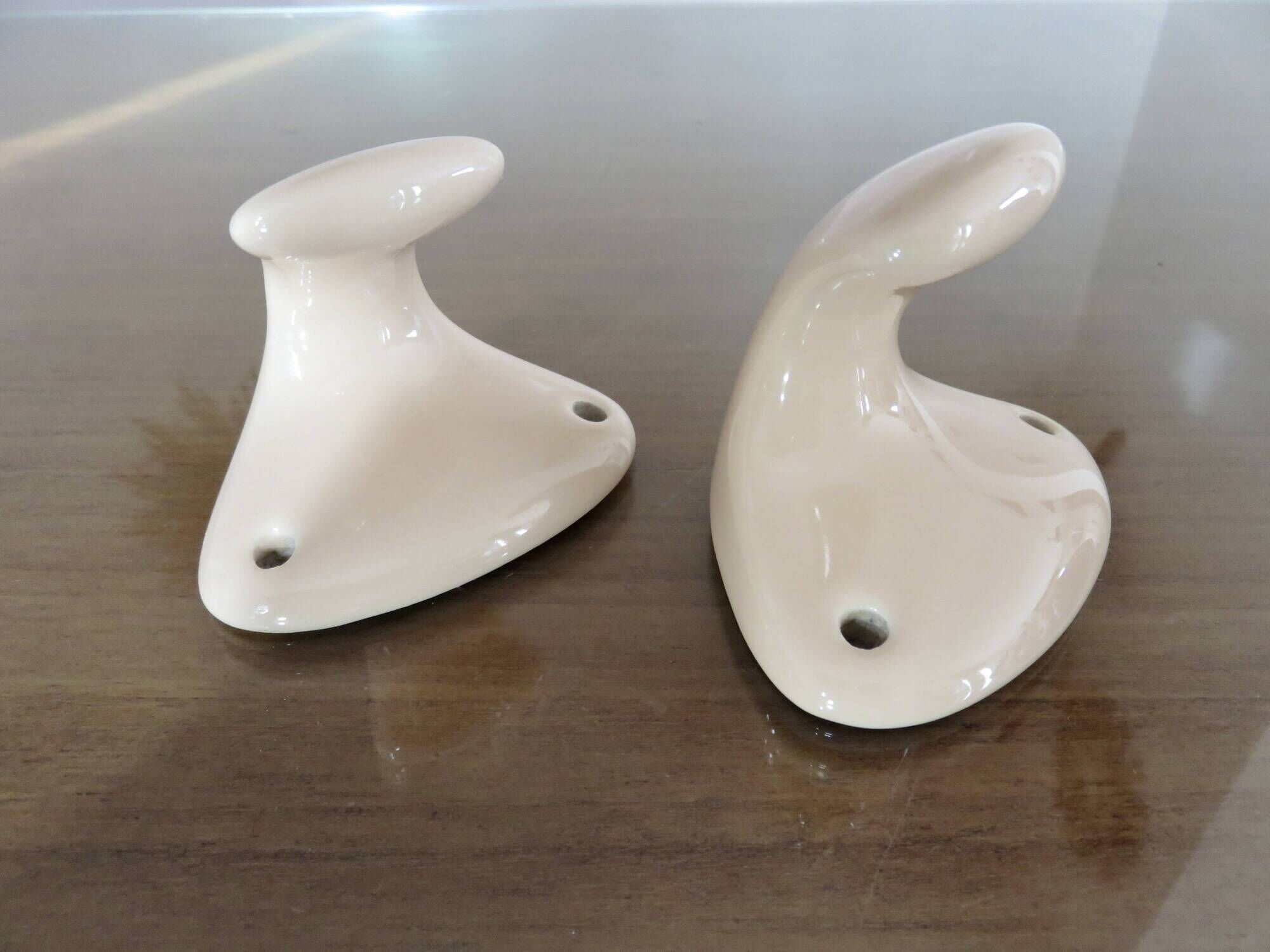Pair of salmon-colored art deco porcelain hooks from the 30s and 40s