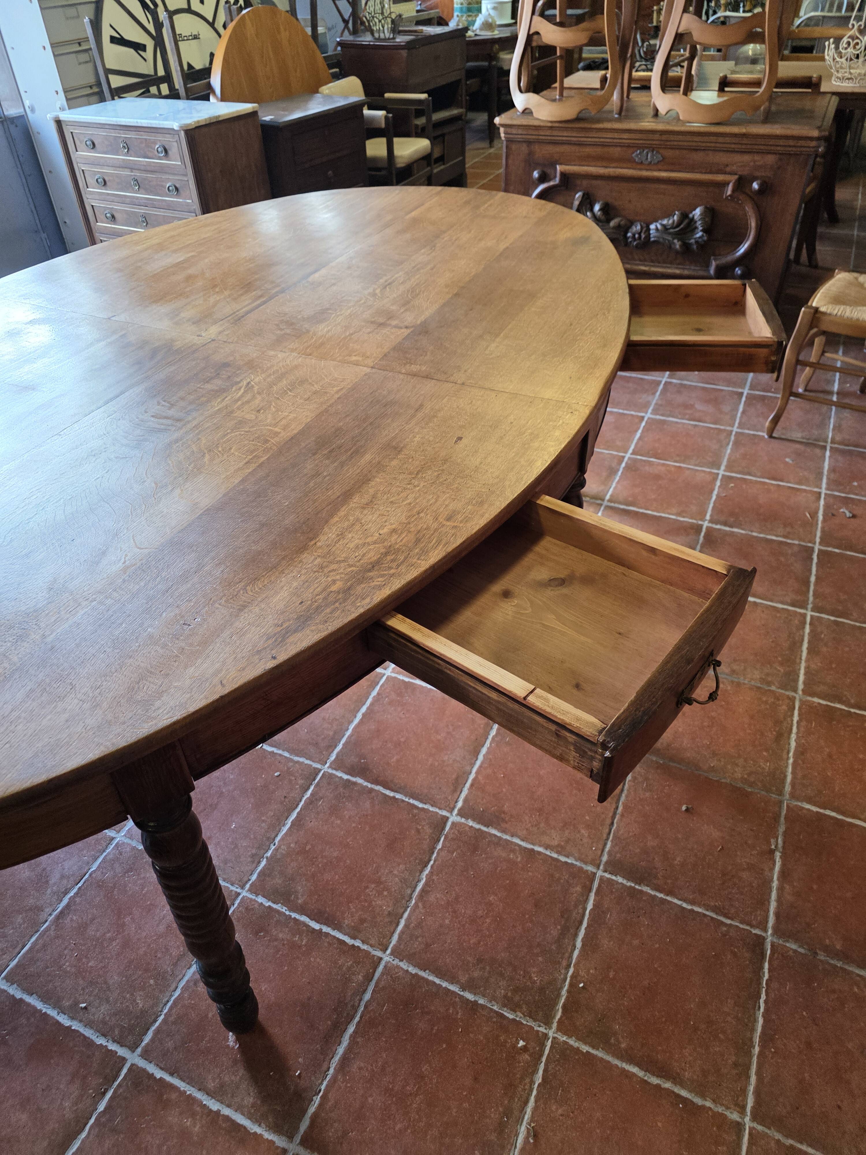 Large oval farmhouse table in solid oak, 19th century, 243 × 153cm