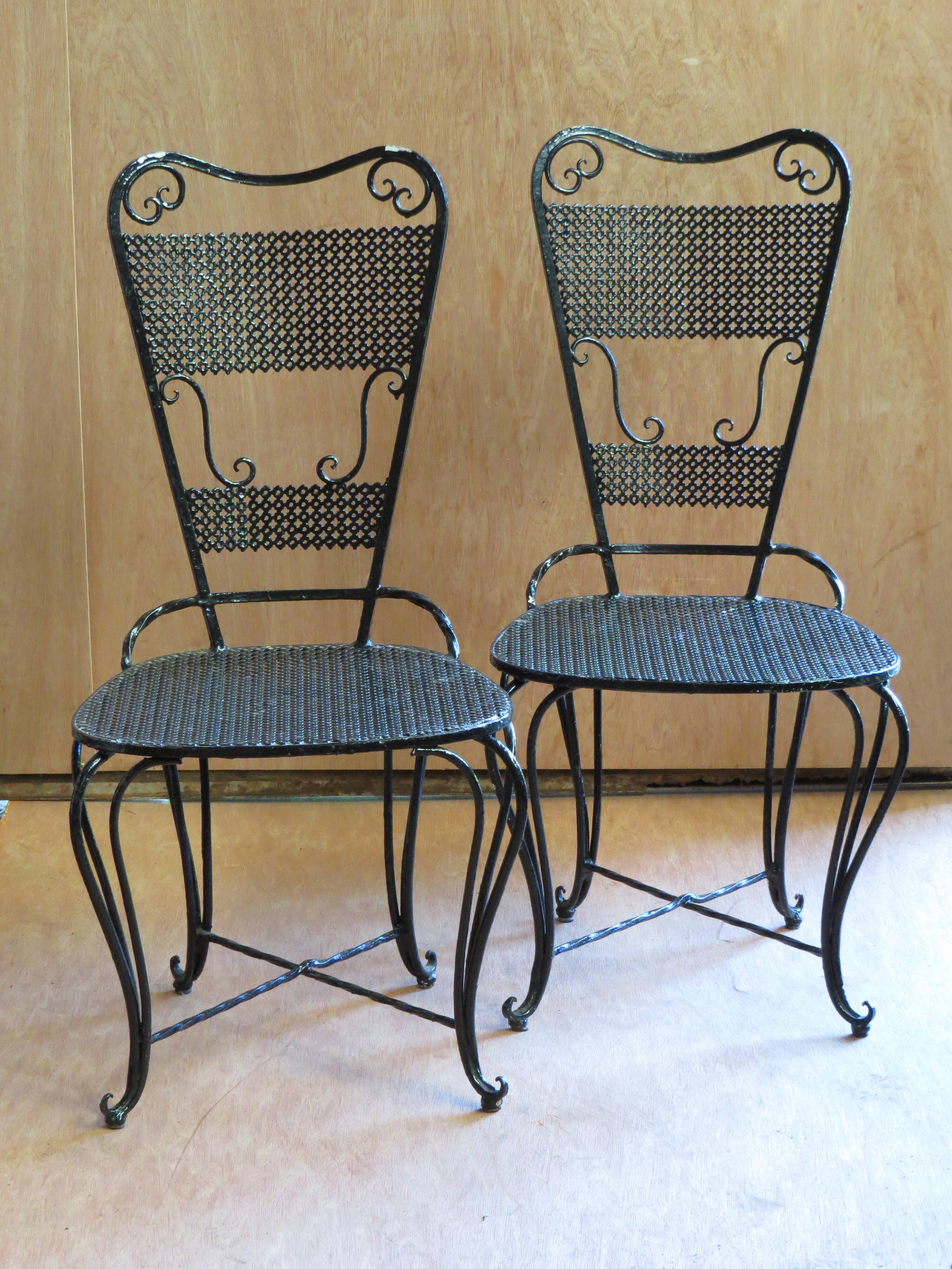 Pair of black lacquered wrought iron garden chairs