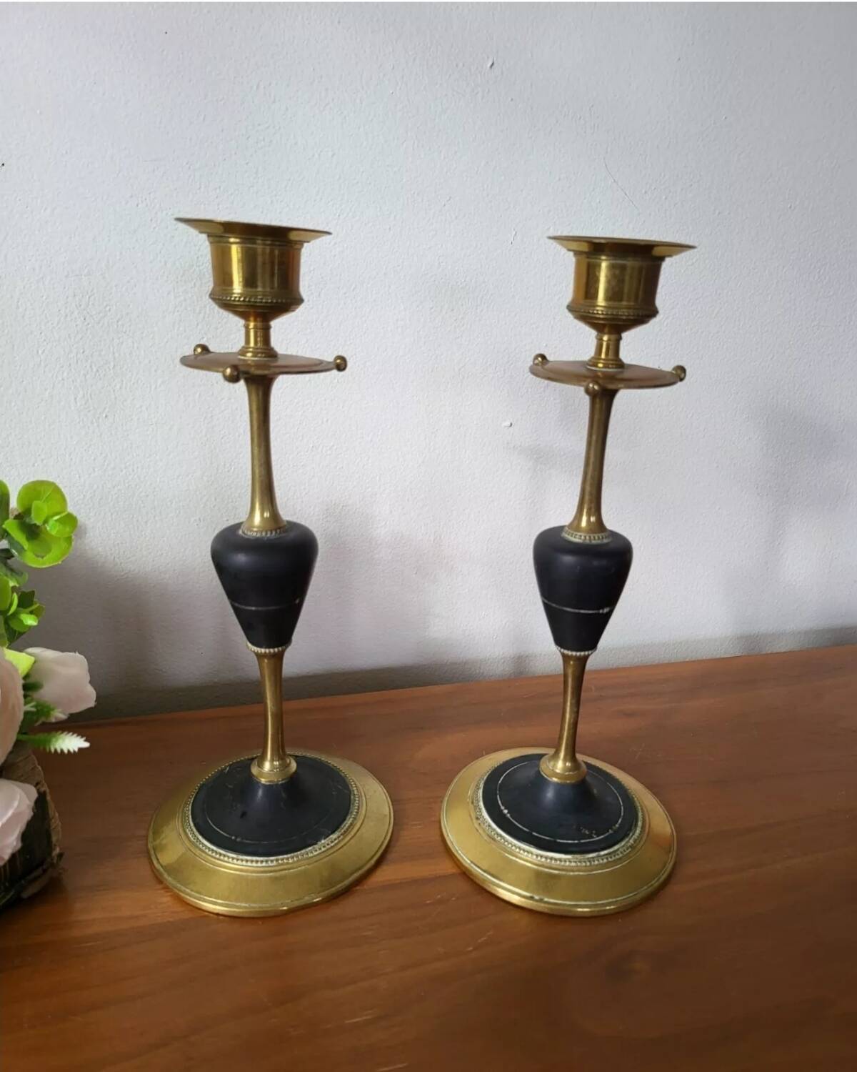 Pair of brass and black hard stone candlesticks