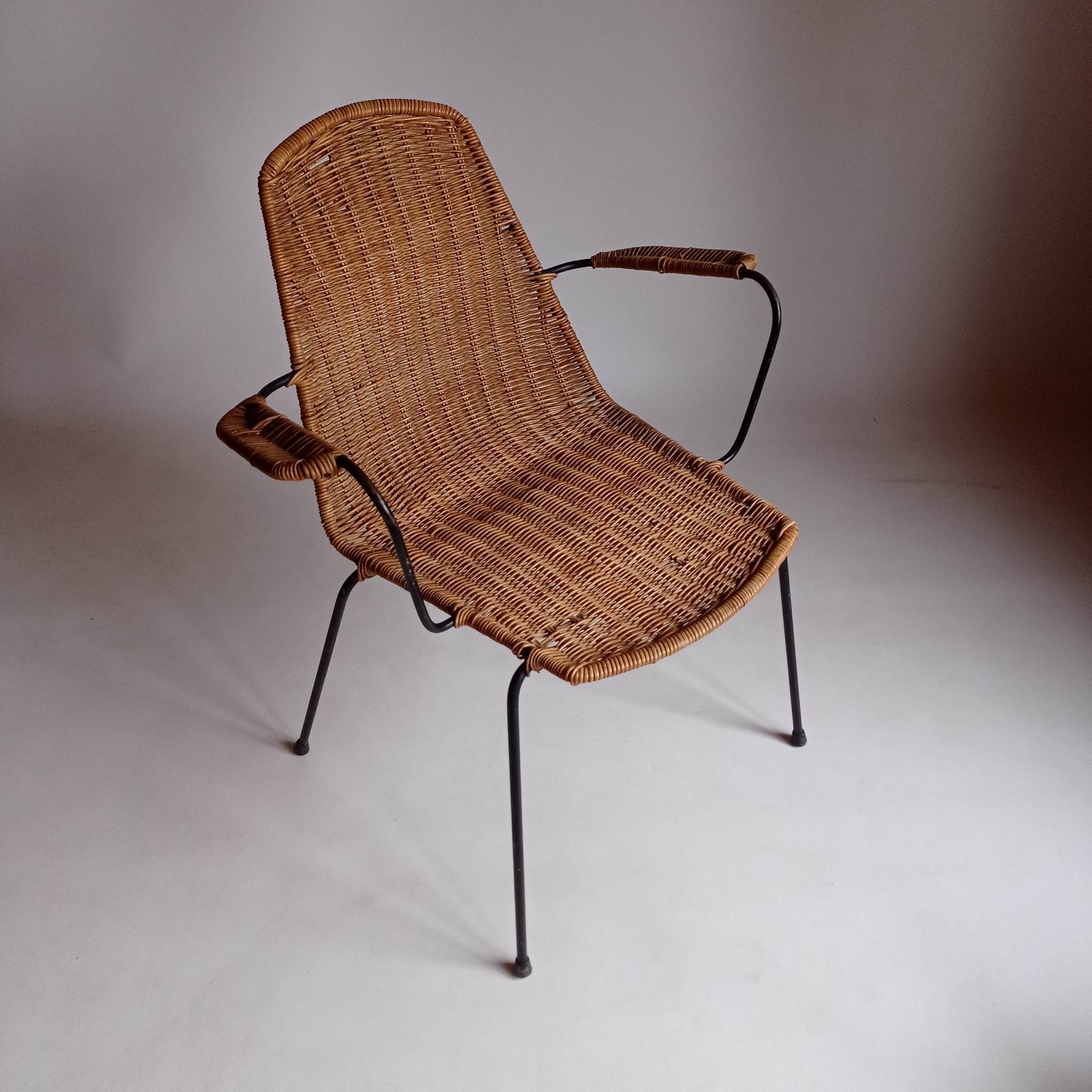 Wicker chair with Campo and Graffi armrests from the 60s.