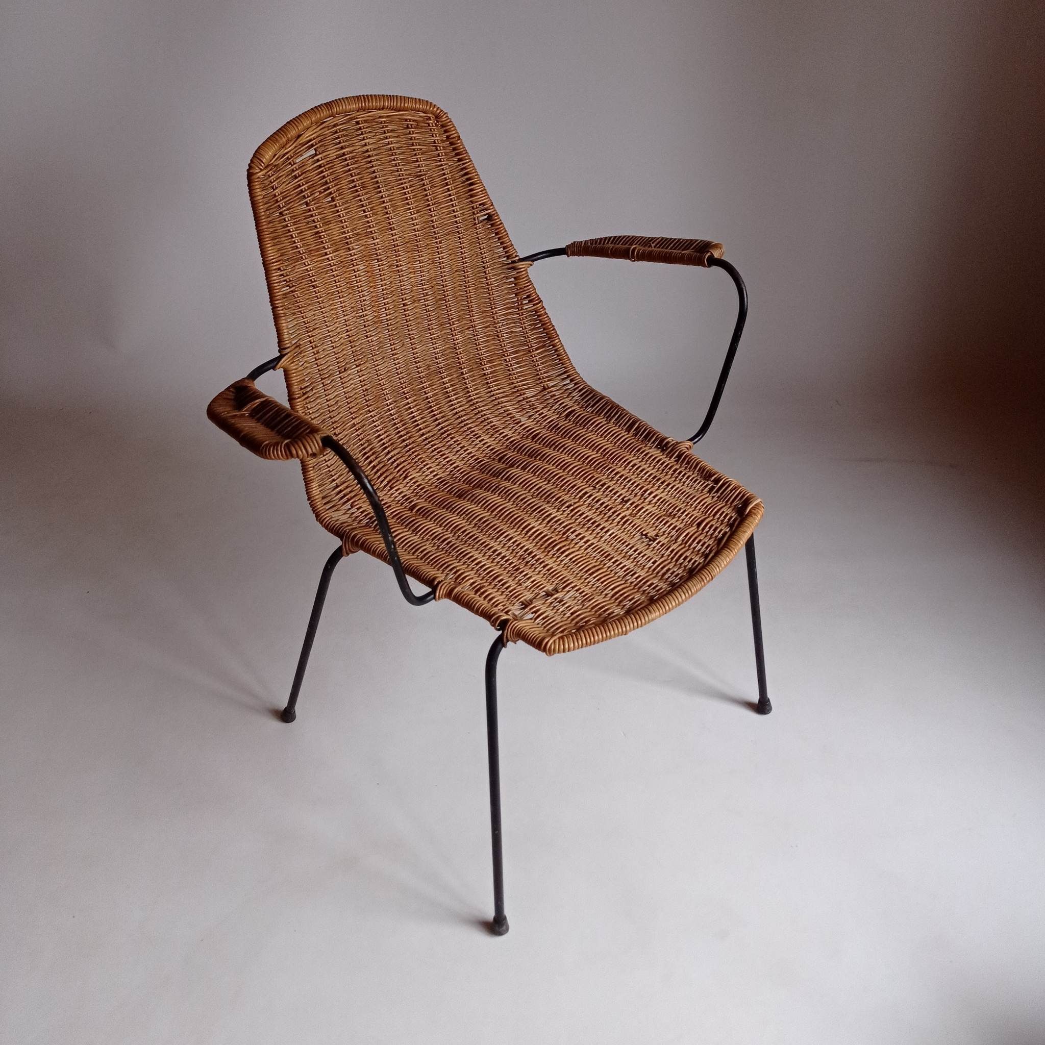 Wicker chair with Campo and Graffi armrests from the 60s.