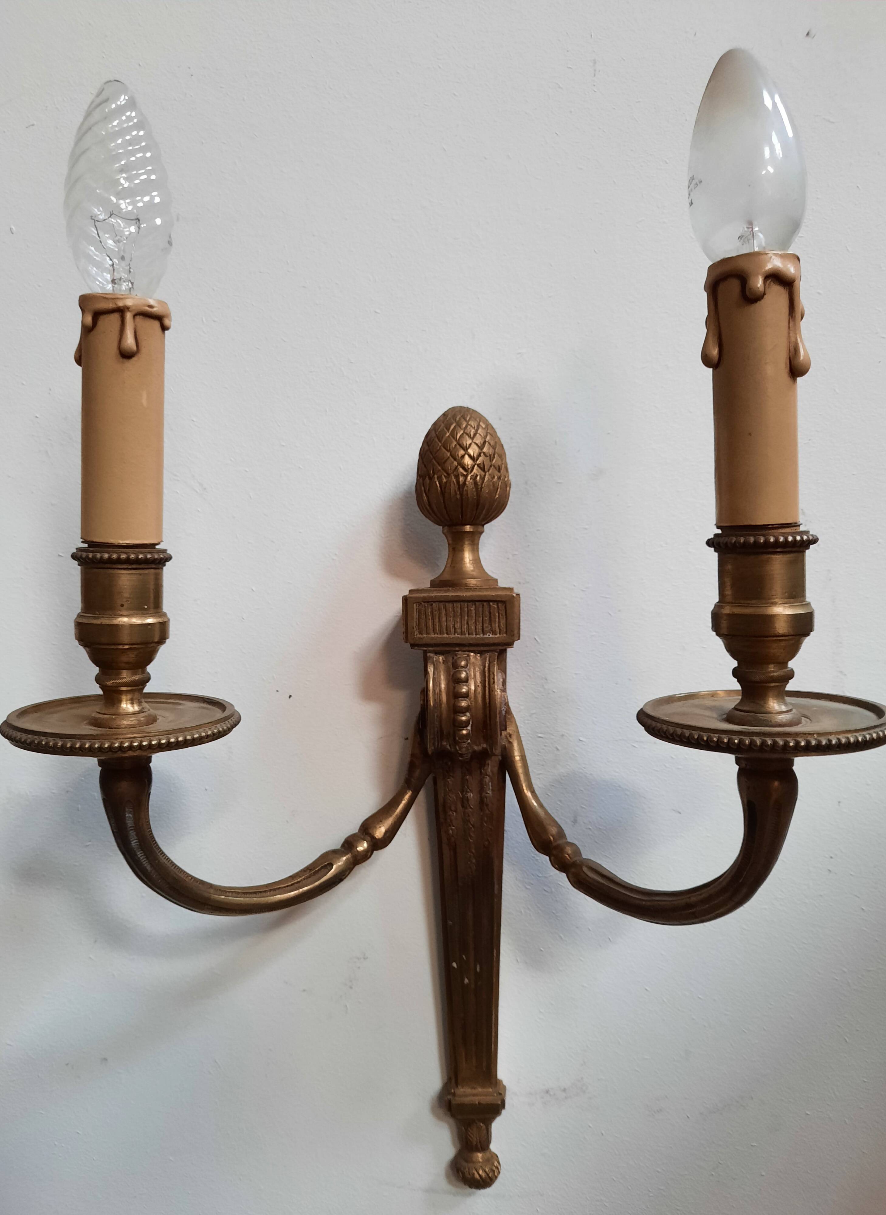 Pair of Louis XVI style bronze wall lights