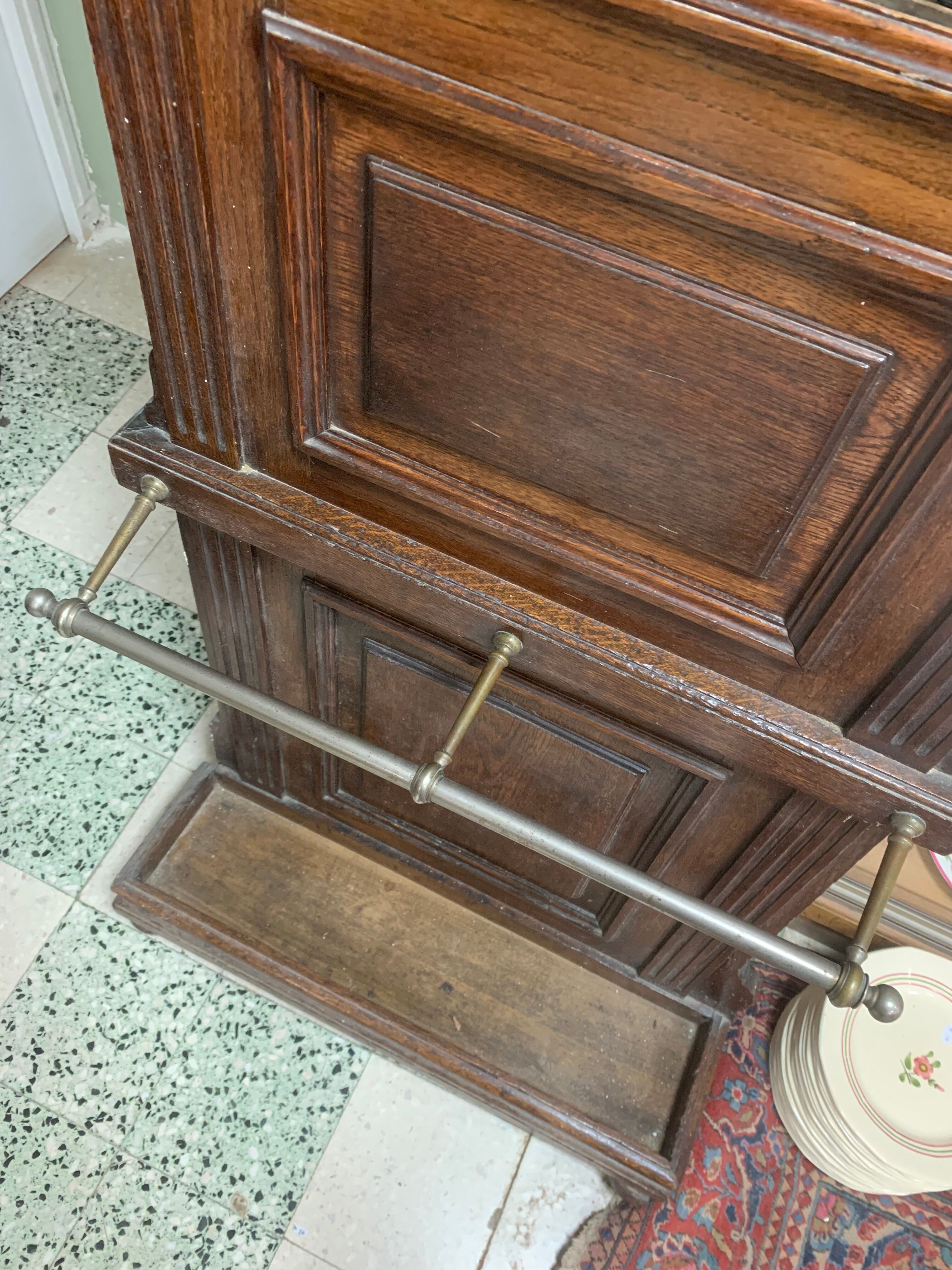 Old wall-mounted mantle-holder cloakroom in see