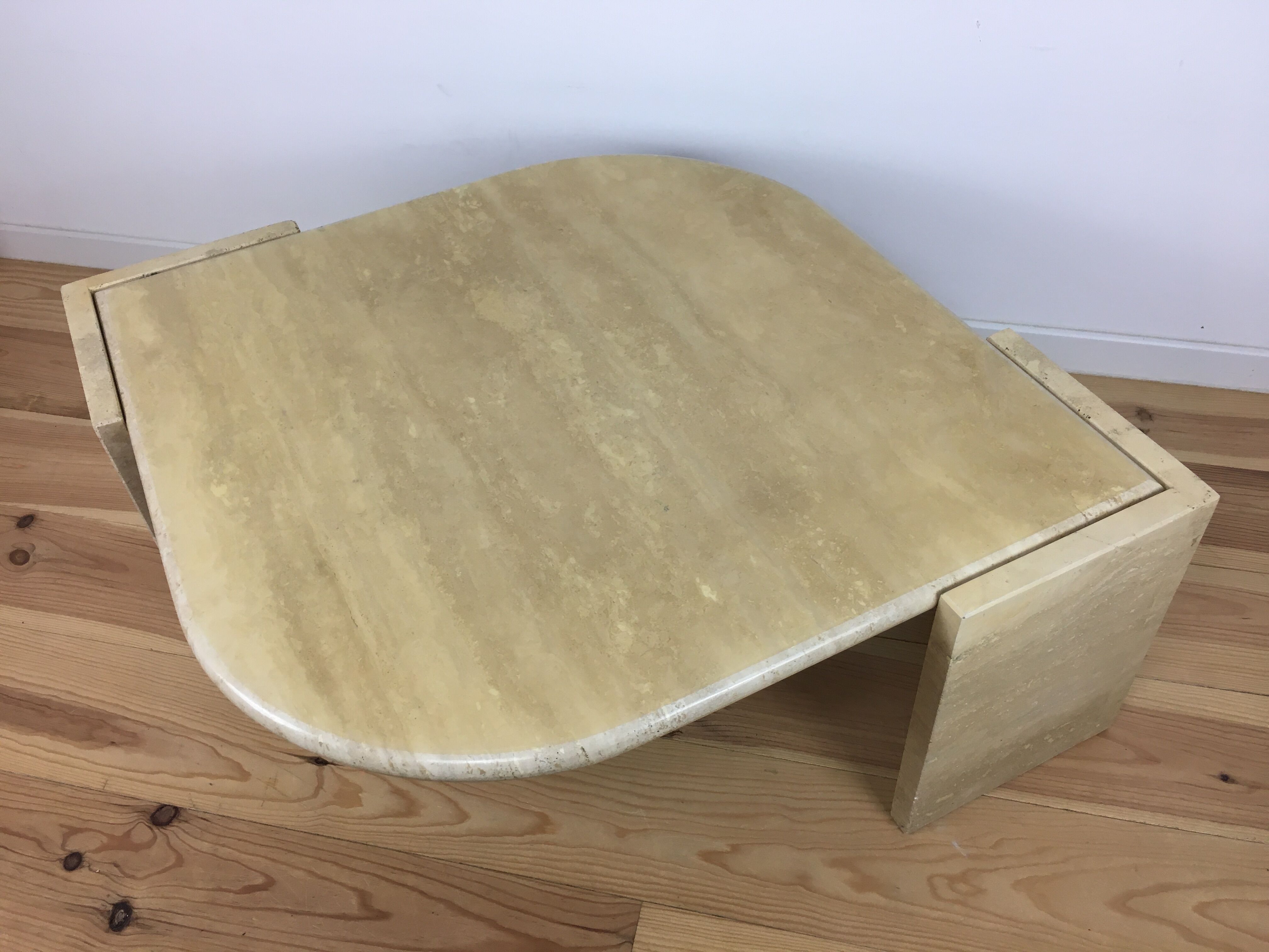 Bass table in travertine Roche Bobois