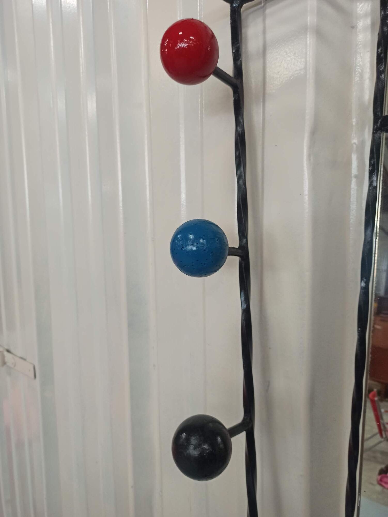 Iron cloakroom wall-mounted port multicolored balls mirror door umbrellas hats circa 50