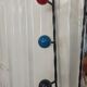 Iron cloakroom wall-mounted port multicolored balls mirror door umbrellas hats circa 50