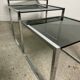 Nesting table in chrome metal and smoked glass 1980