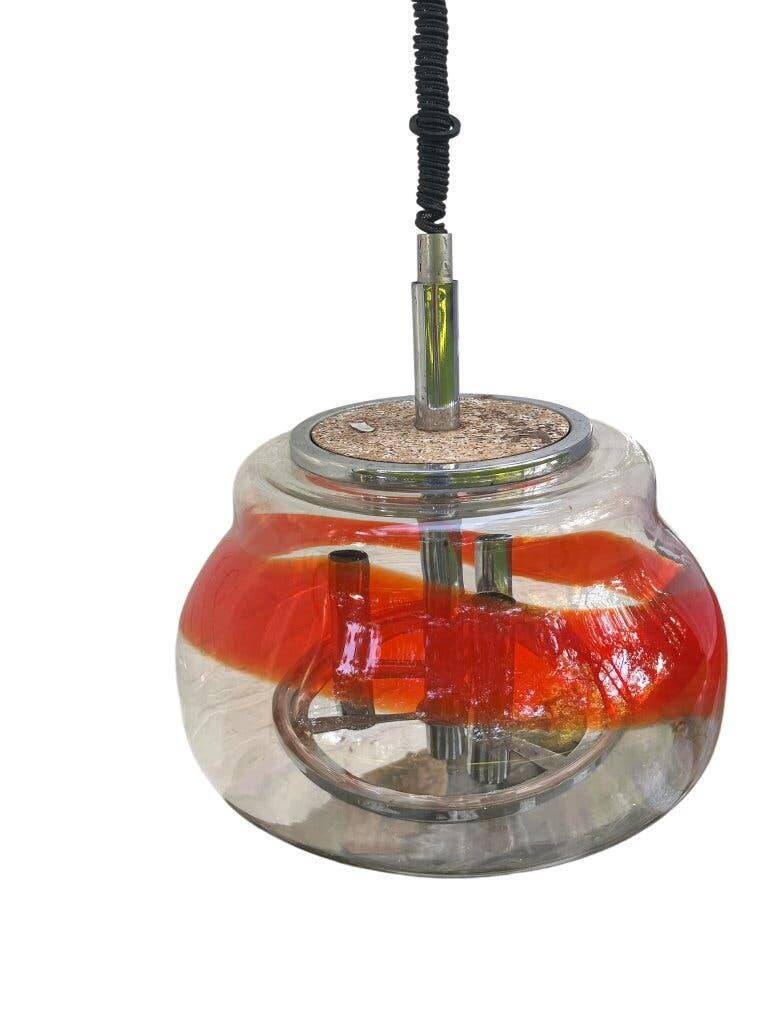 Vintage Murano glass pendant light with orange accent.