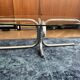 Oval glass coffee table with chrome legs, vintage 70s design.