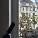 Old black metal and brass wall light, adjustable, 1930s.