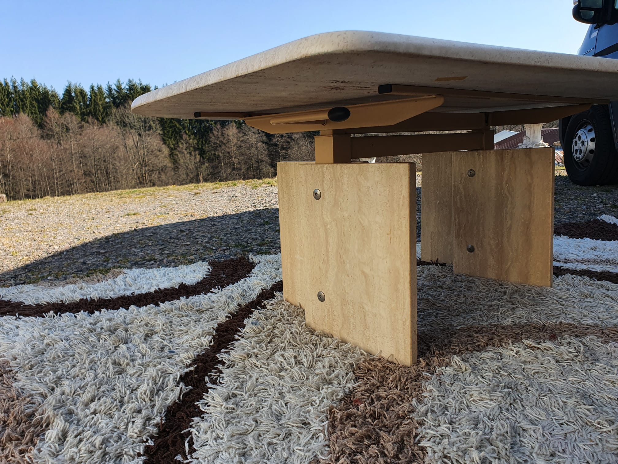 Adjustable travertine coffee table eye shape