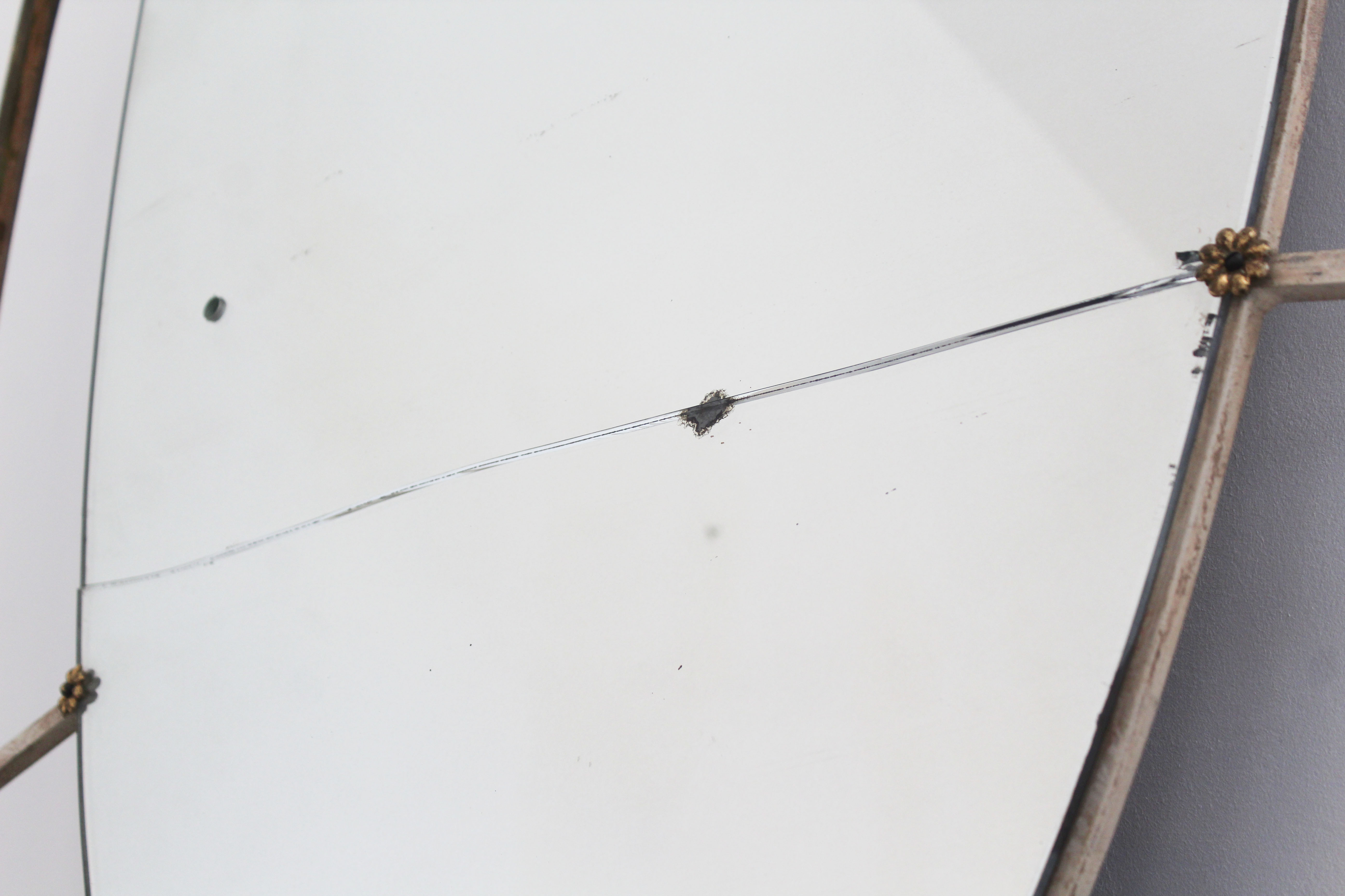 Oval mirror in art deco brass, Italy 1940s.