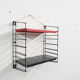 Red and black metal book shelves by Tomado, The Netherlands 1950's