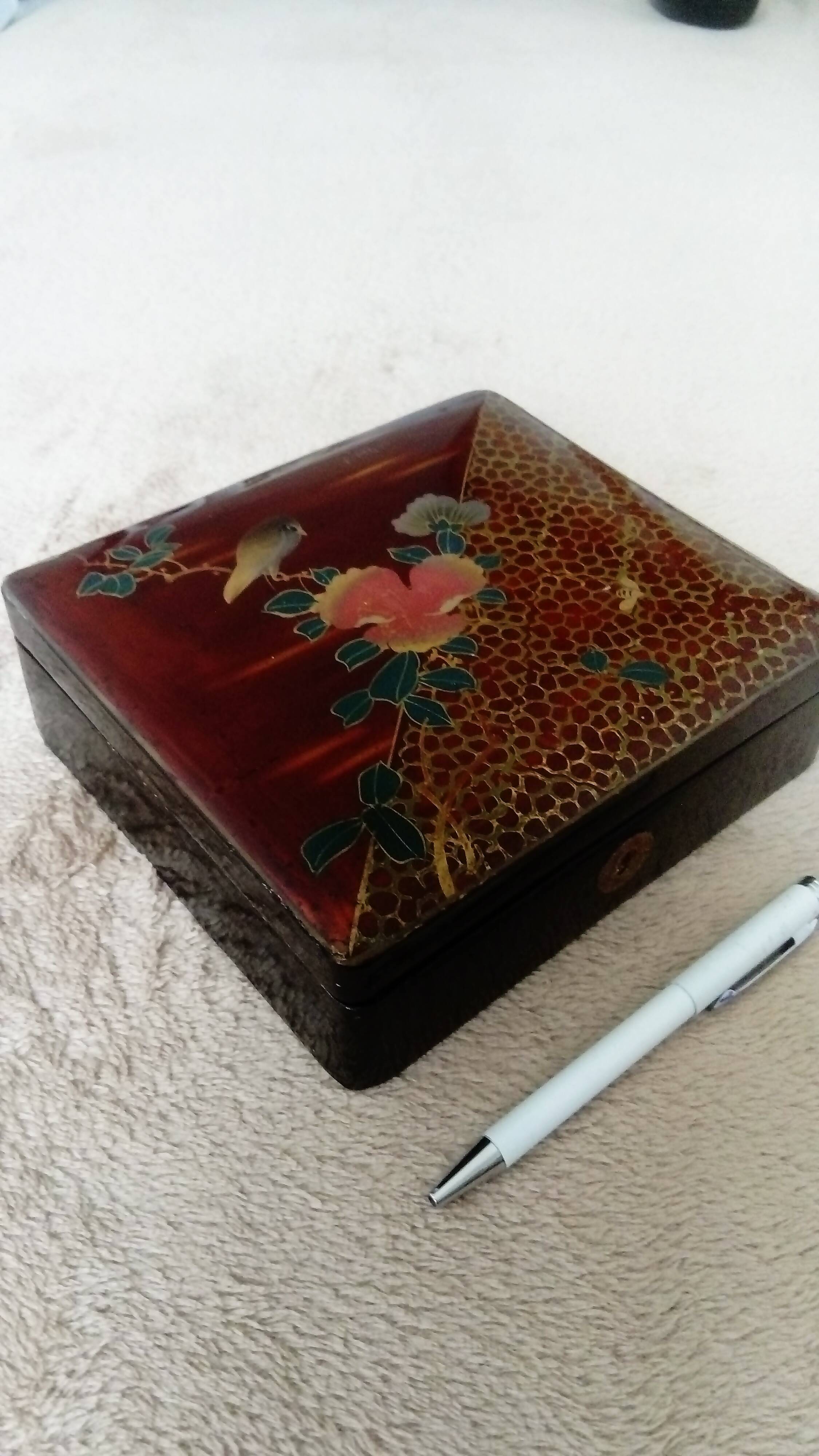 Old lacquered jewelry box with Asian decoration bird, flower, bee