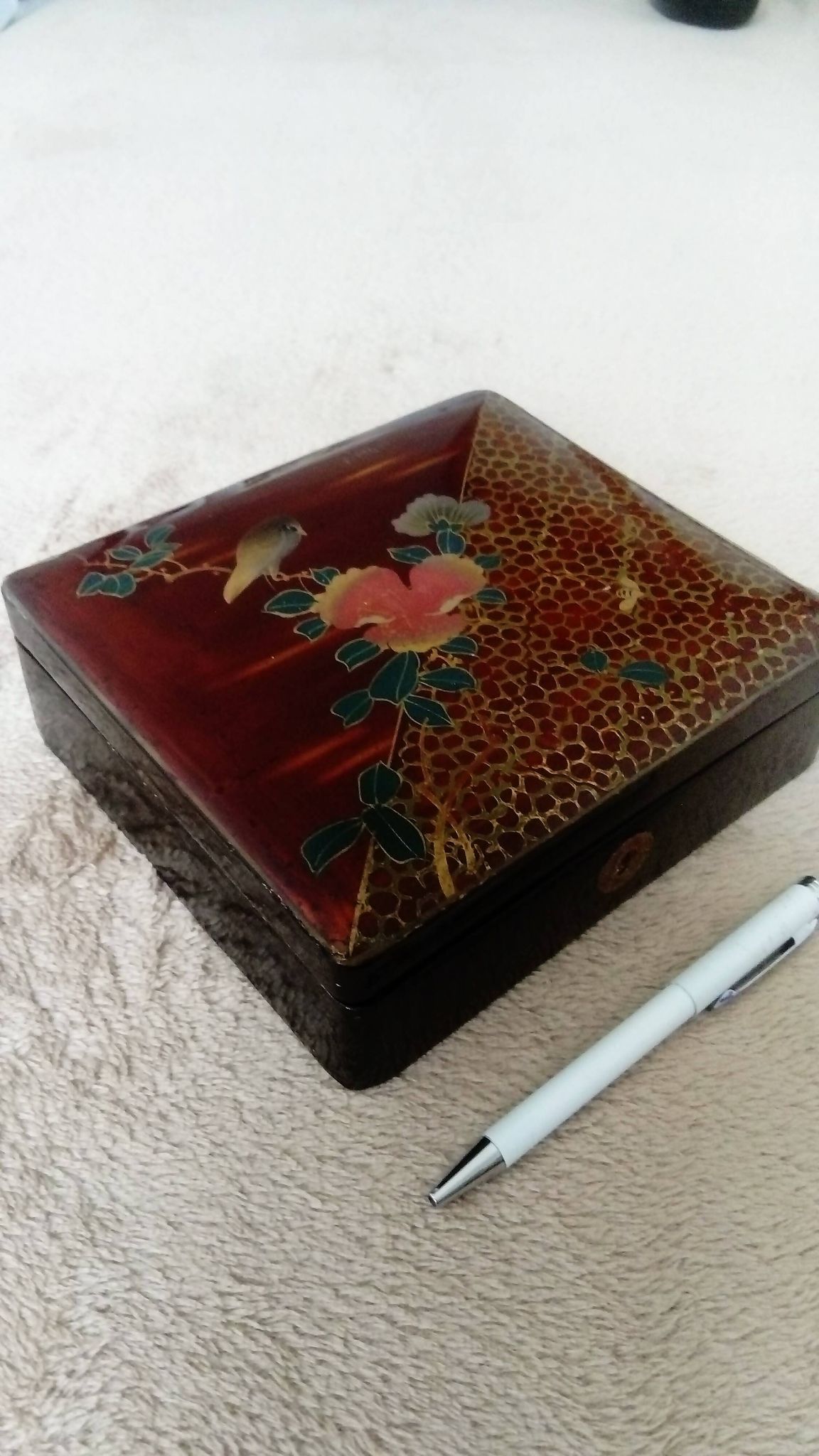 Old lacquered jewelry box with Asian decoration bird, flower, bee