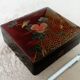 Old lacquered jewelry box with Asian decoration bird, flower, bee