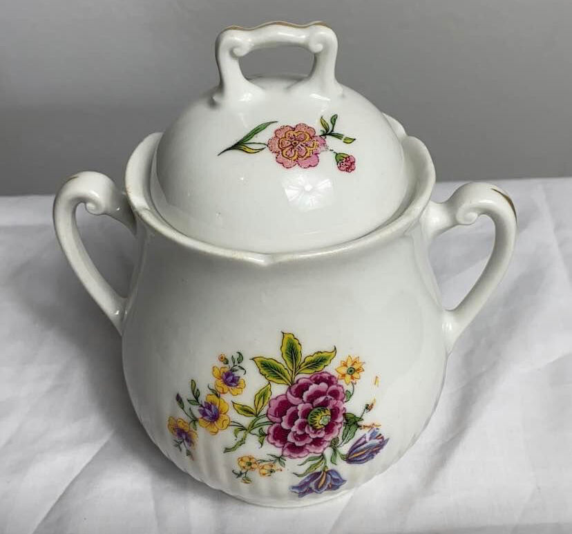 Antique porcelain teapot and sugar bowl