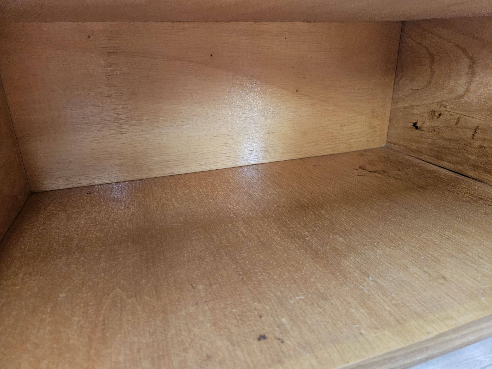 Pair of maple bedside tables from the 1950s with mirrored tops.