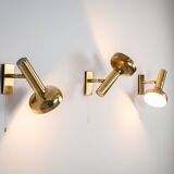 Set of three brass adjustable wall lamps