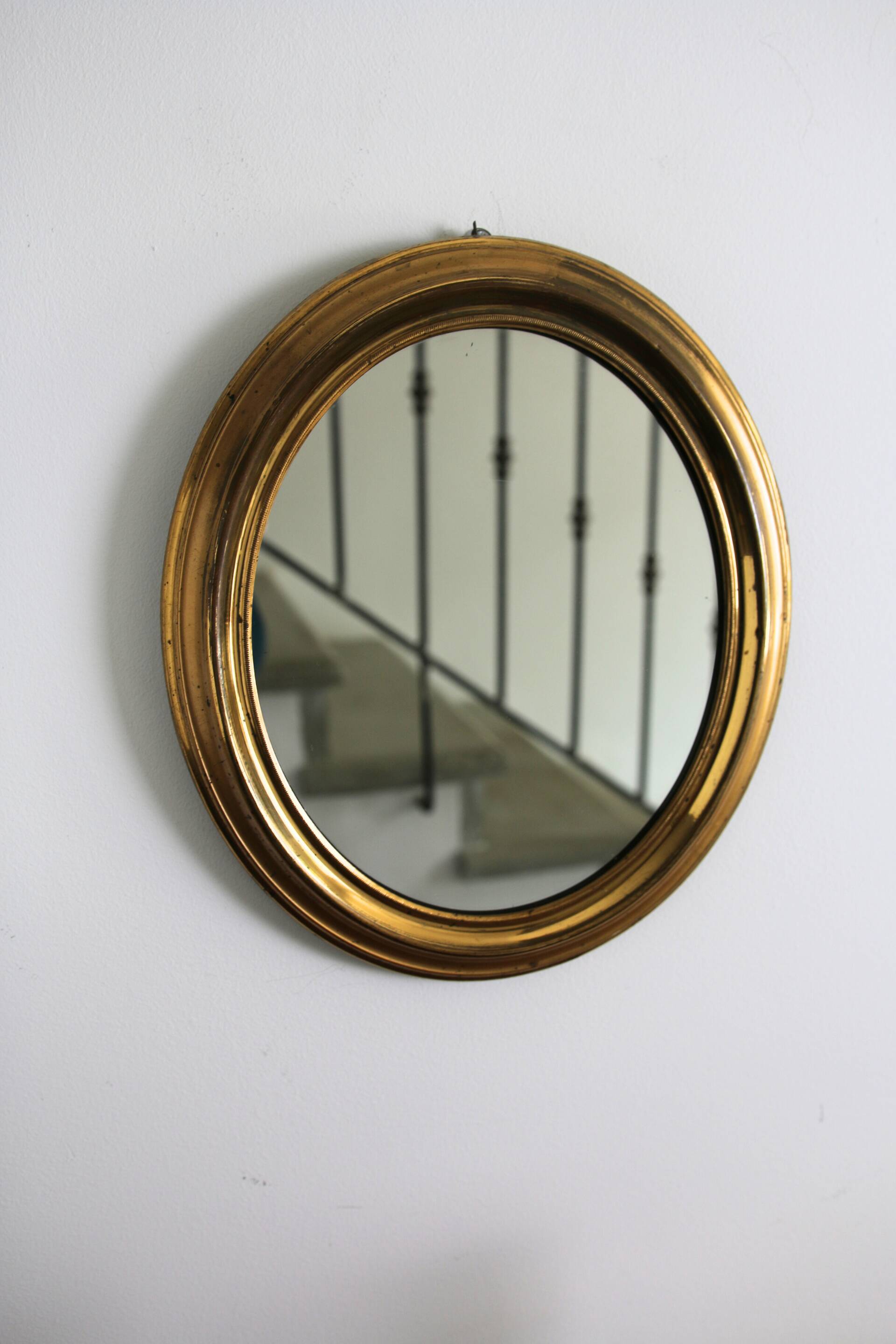 Oval brass mirror
