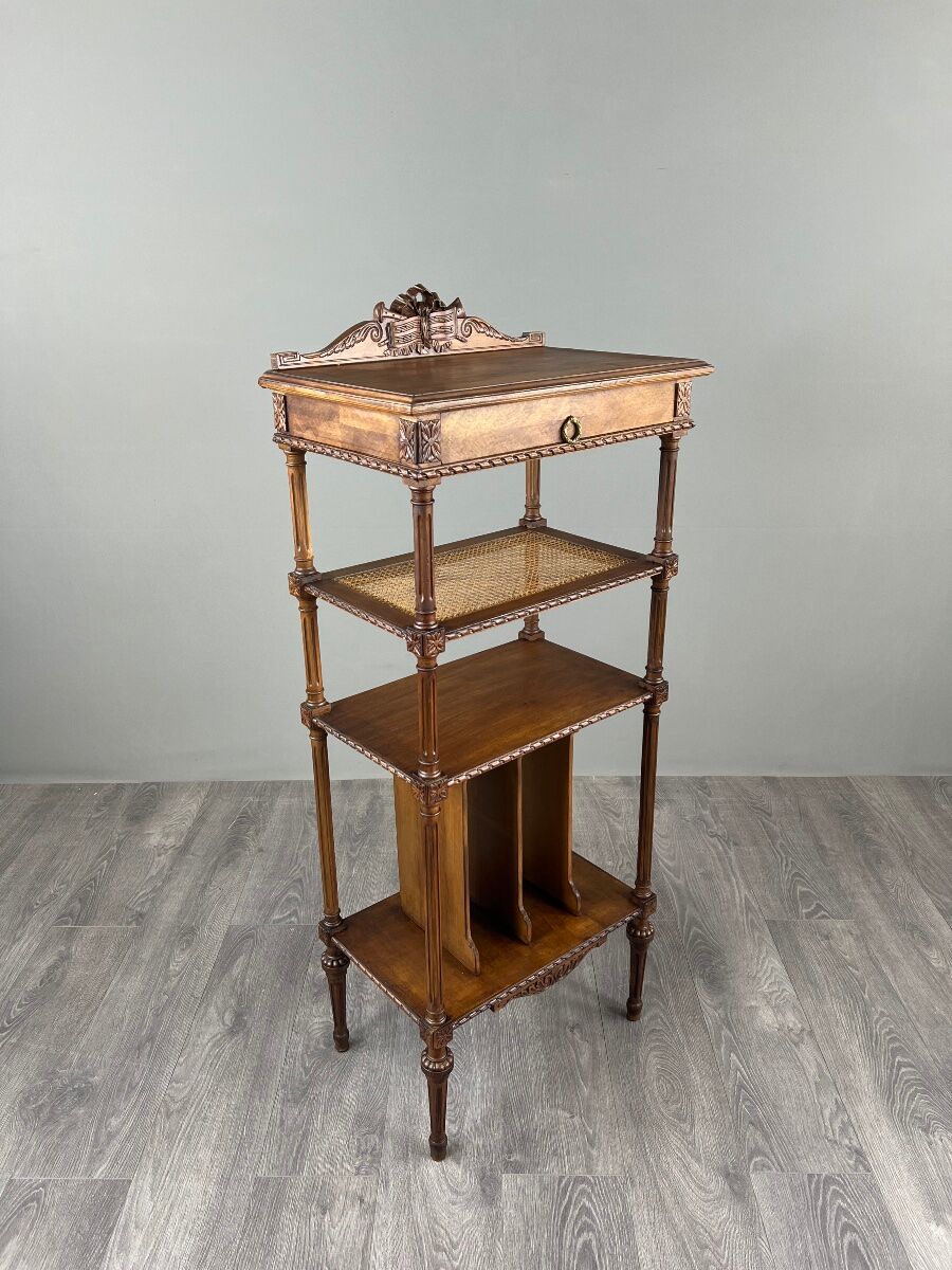 Louis XVI style music cabinet in carved wood with caning, 19th century.
