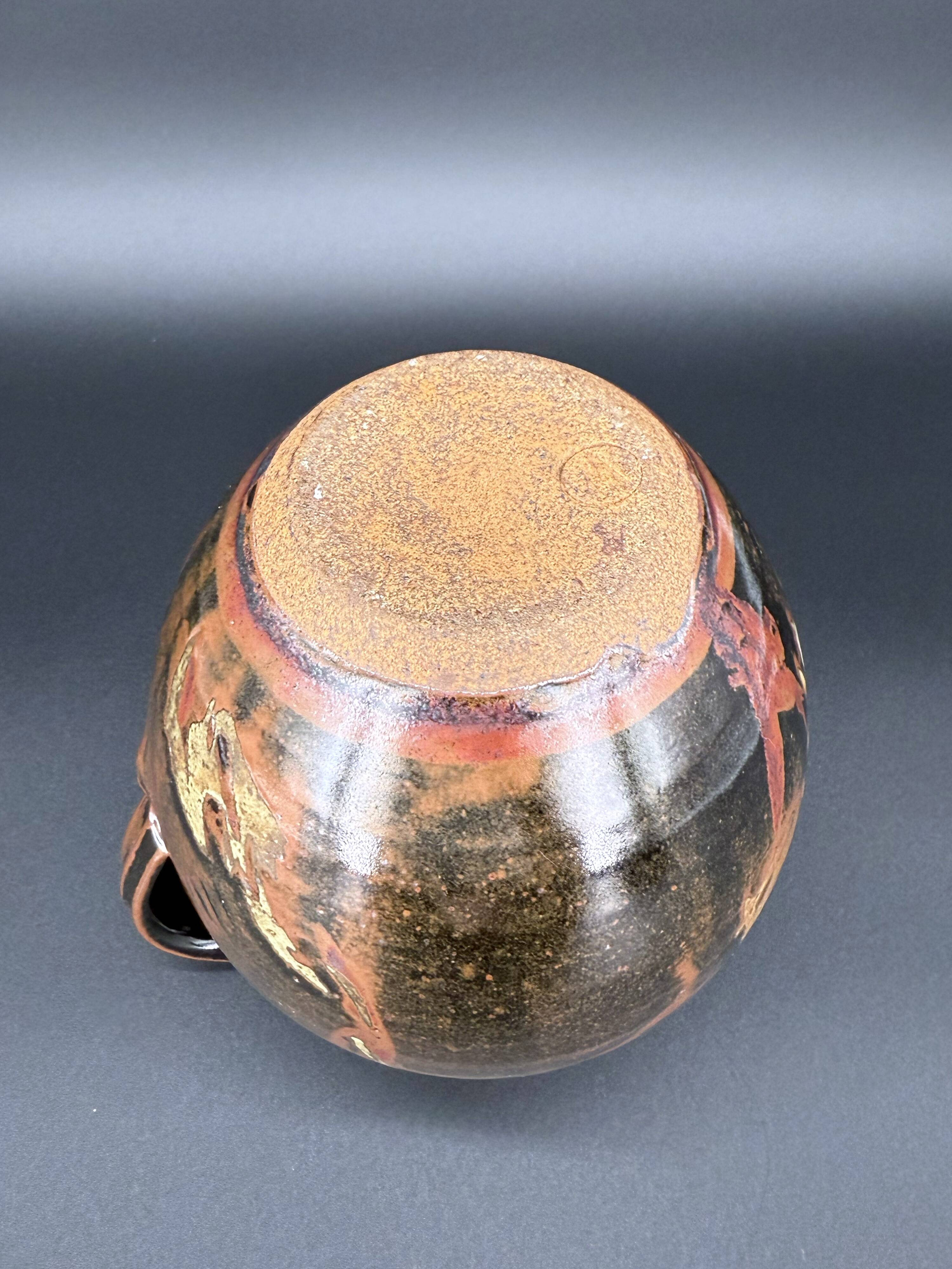 Signed black and red glazed stoneware pitcher, French artisanal ceramics