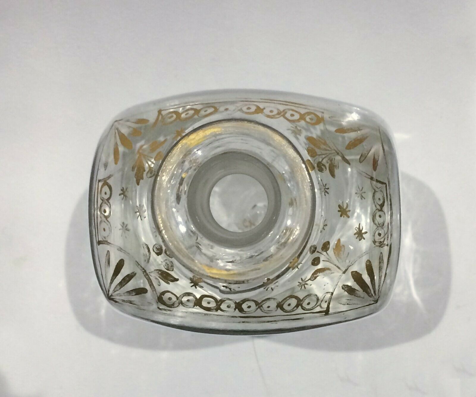 Glass bottle decorated with gold motifs