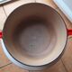 LeCreuset Enzo Mari orange red enamelled cast iron round casserole dish 23 cm perfect condition
