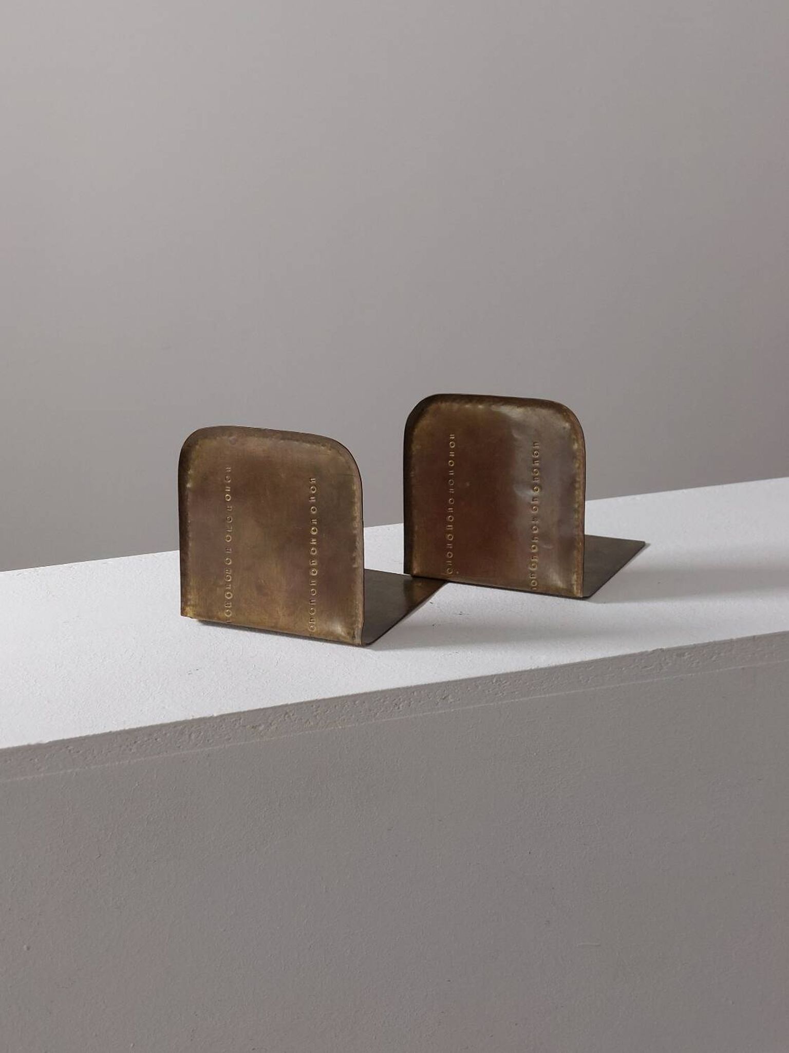 Pair of hand-hammered brass bookends by Hayno Focken