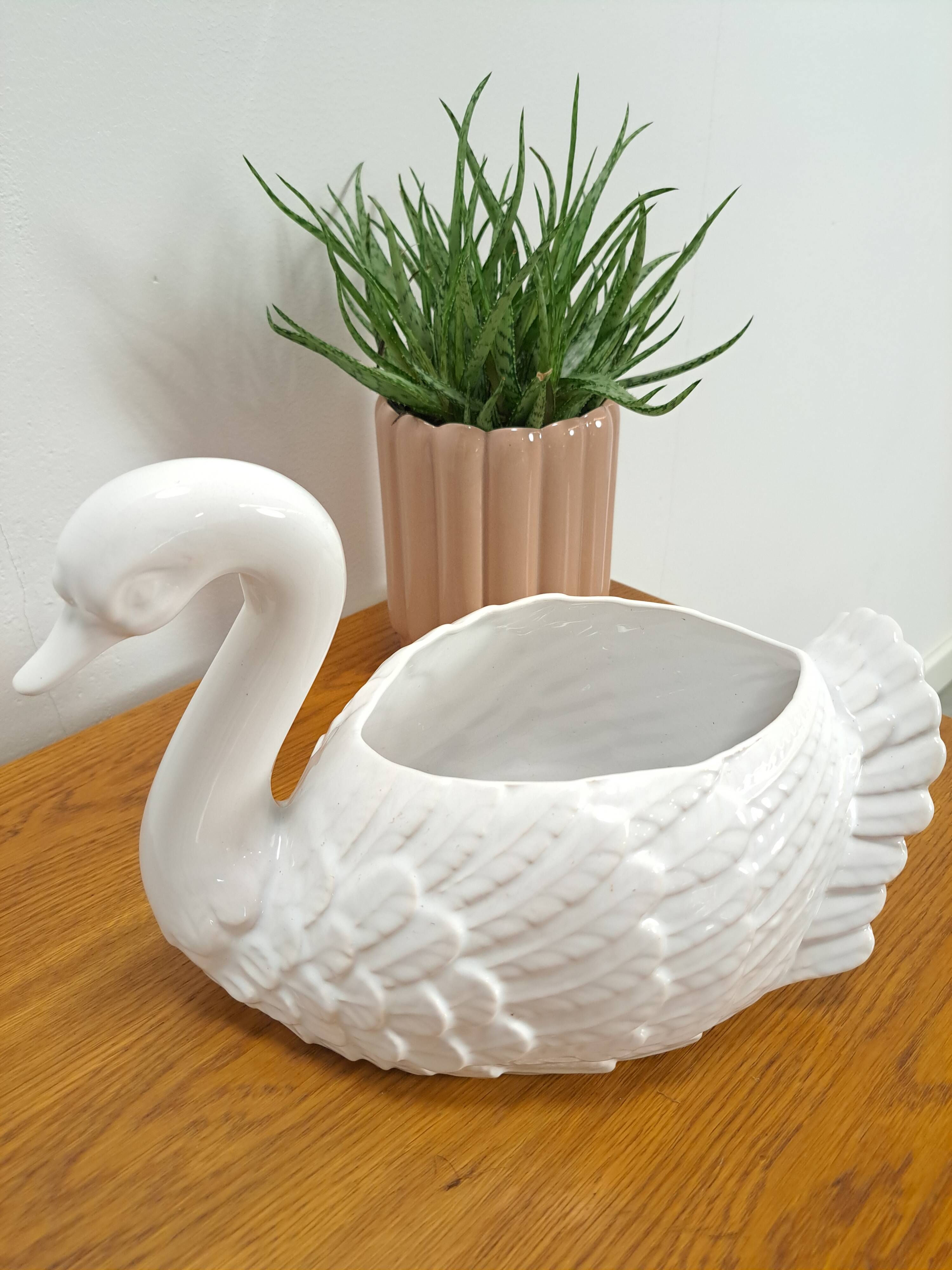 vintage porcelain flower pot in the shape of a swan