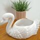 vintage porcelain flower pot in the shape of a swan