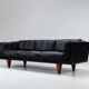 Illum Wikkelso model V11 sofa in black leather by Holger Christiansen, Denmark, 1960