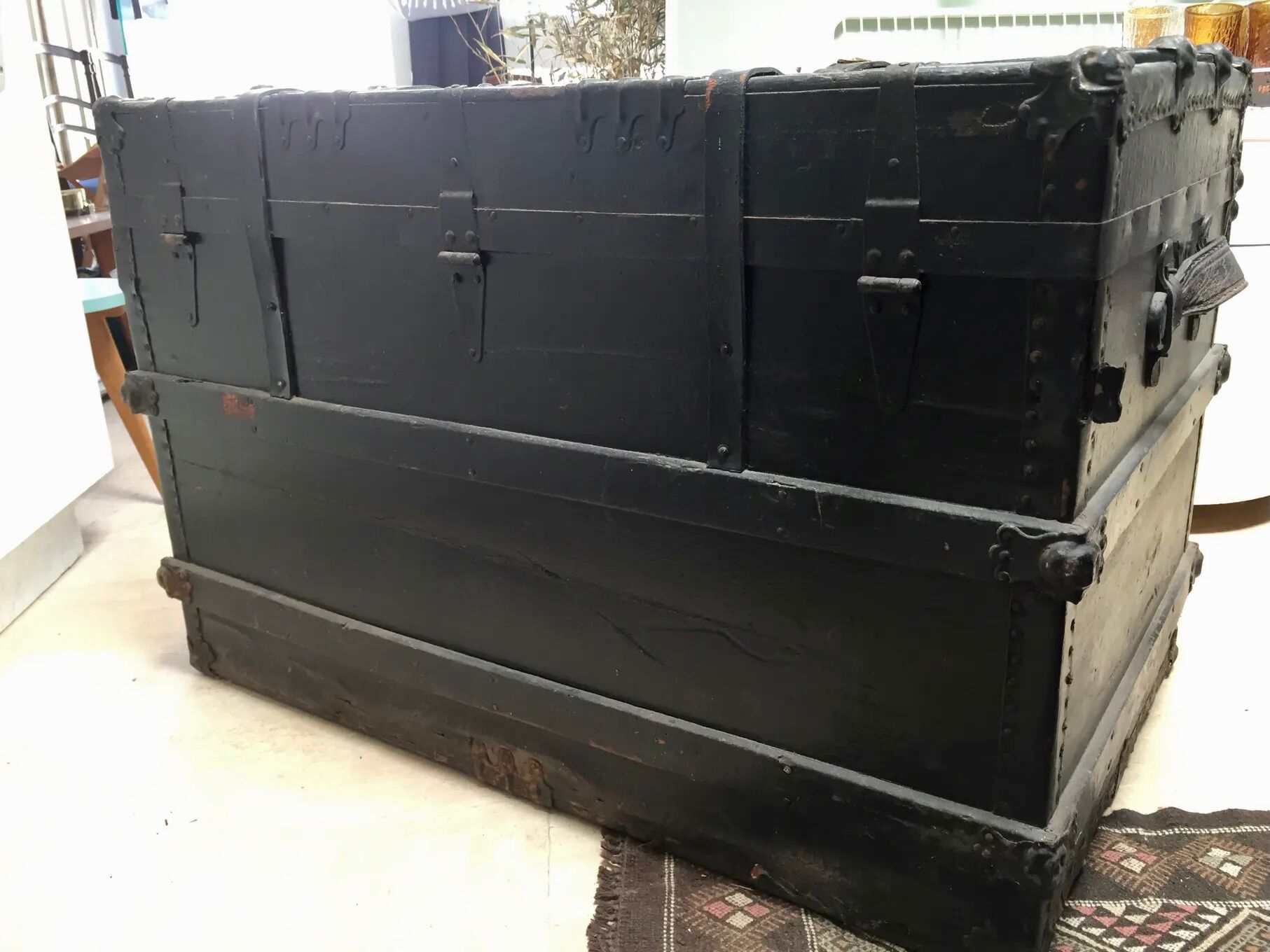 Black ancient travel trunk, 19th