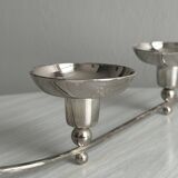 Shiny stainless steel candlestick holder