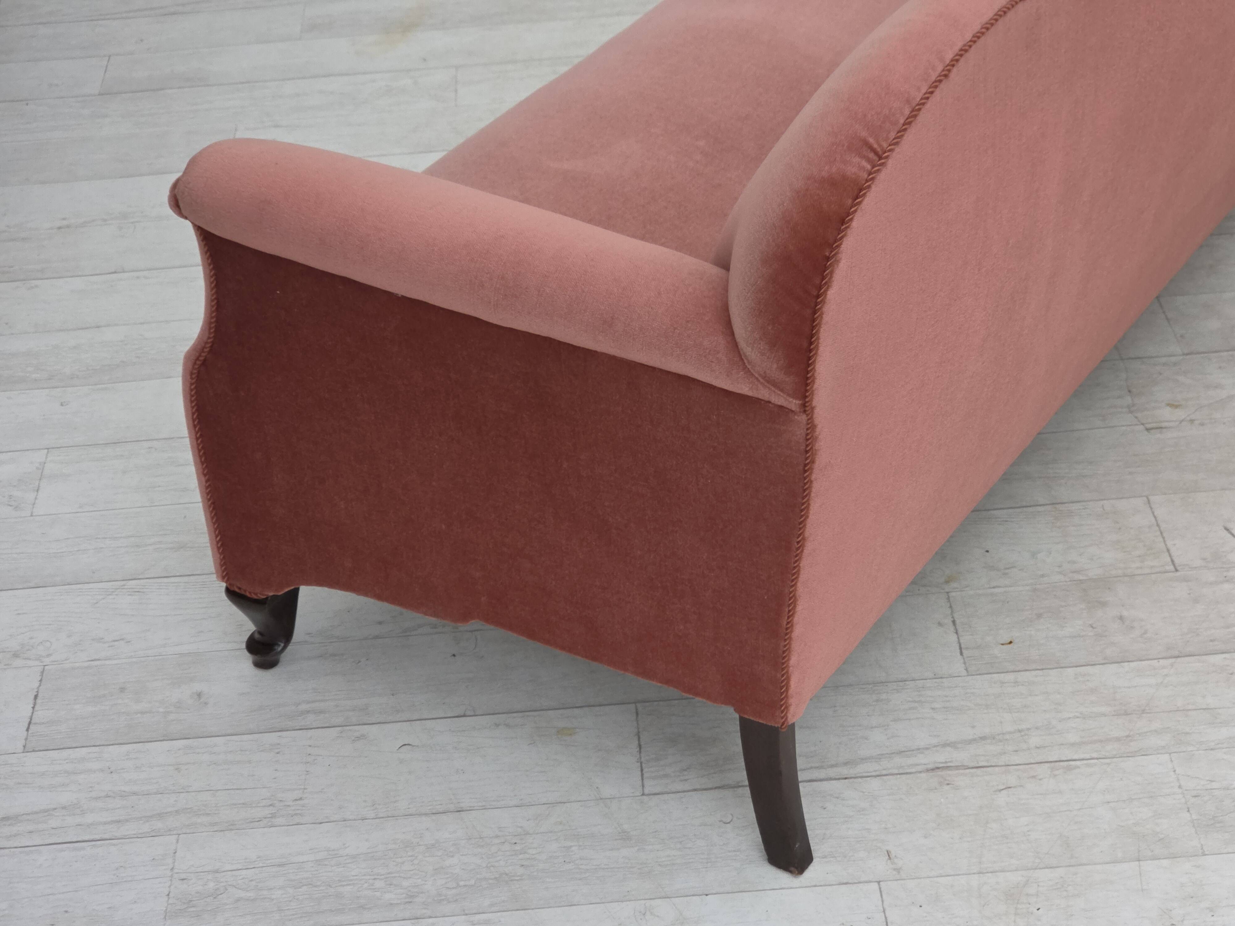 1950s, Danish 2-seater sofa, salmon pink furniture velour, oak wood legs.