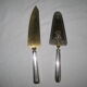 silver metal knife and cake shovel