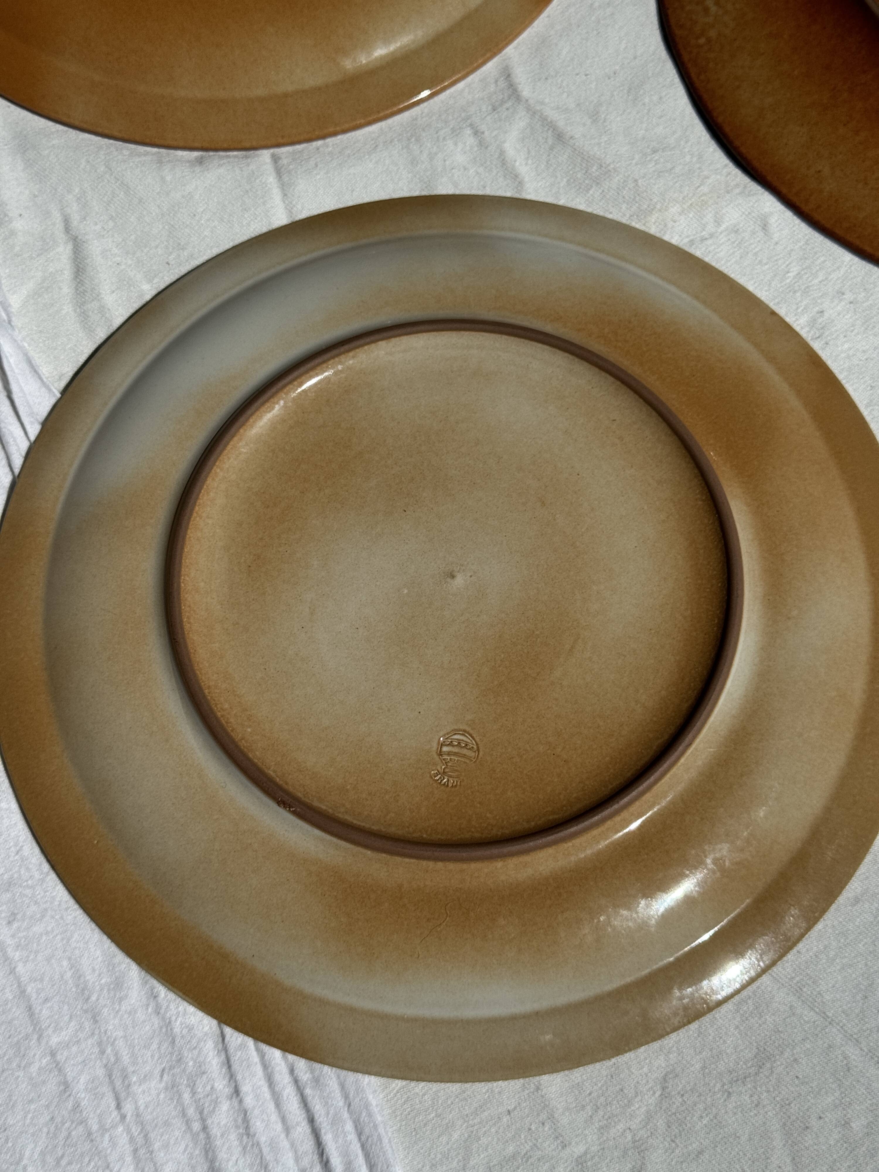 Set of 4 vintage stoneware plates, including 2 with floral motifs