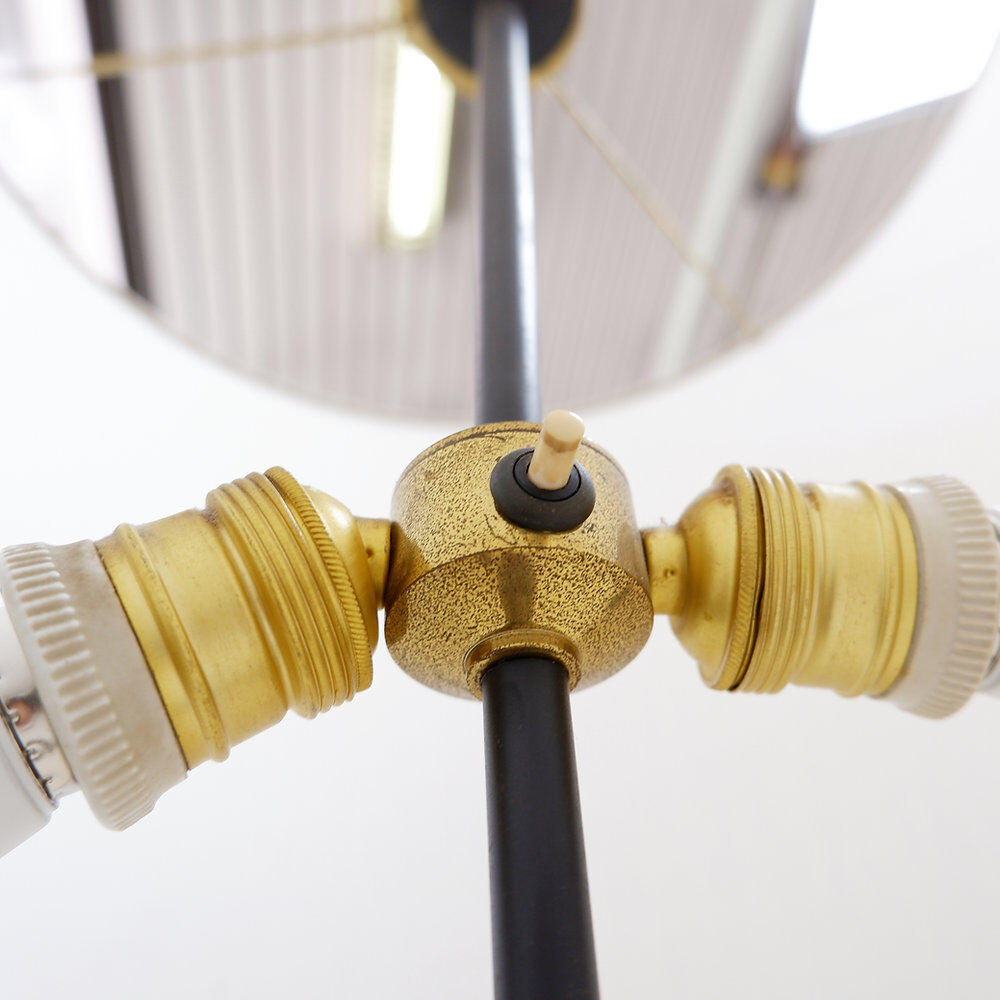Tripod floor lamp in wrought iron and brass with bamboo-style base.