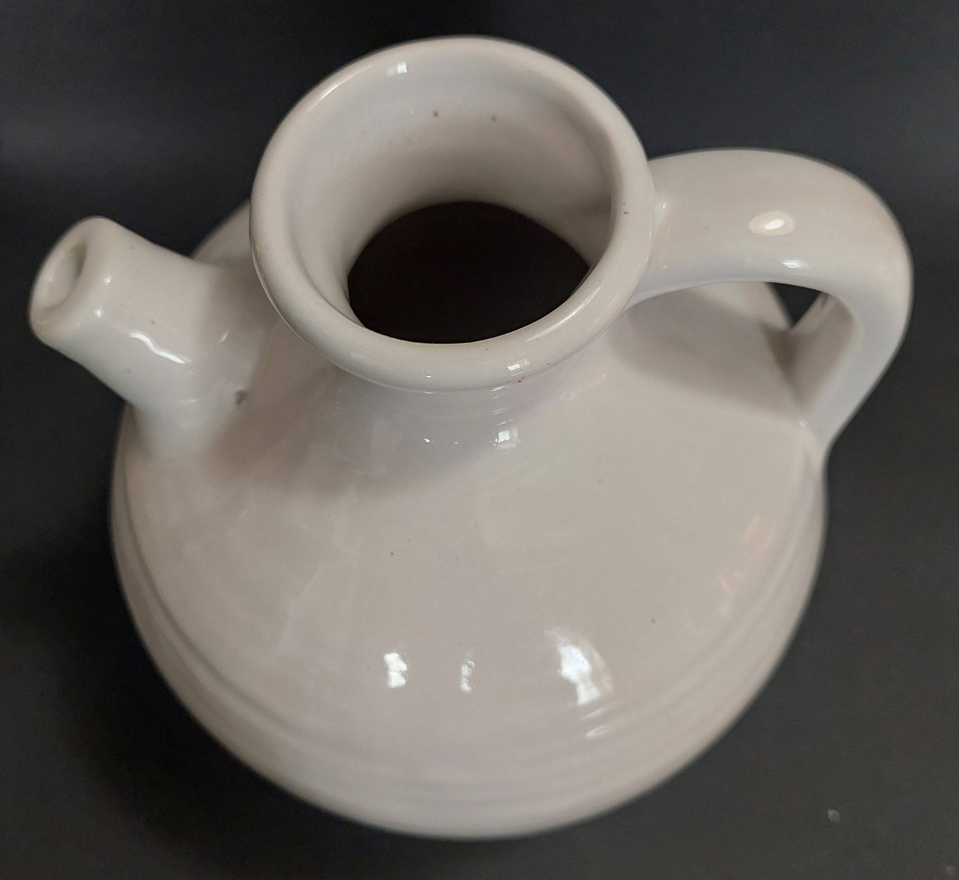 White ceramic goat-shaped creamer, first half of the 20th century.