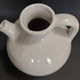 White ceramic goat-shaped creamer, first half of the 20th century.